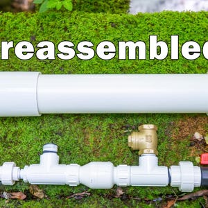 May include: A preassembled white PVC pipe and plumbing components are displayed against a backdrop of green moss. The components include valves, connectors, and a brass fitting, suggesting a DIY or home improvement theme.