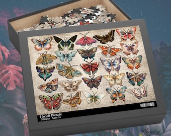 May include: A 500 piece jigsaw puzzle featuring a vintage illustration of colorful butterflies on a newspaper background. The puzzle box is open, revealing the puzzle pieces inside. The box has the text "16x20 Puzzle 500 pcs Ages 9+" on the front.