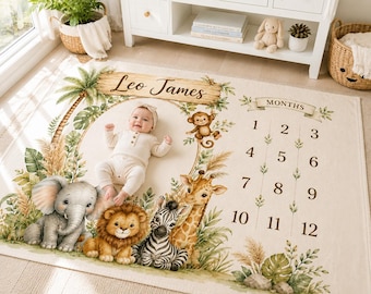 May include: A rectangular milestone blanket featuring a jungle theme with illustrations of an elephant, lion, zebra, giraffe, and monkey. The blanket includes the name Leo James, a circular frame for a baby, and numbers 1 through 12 for months.