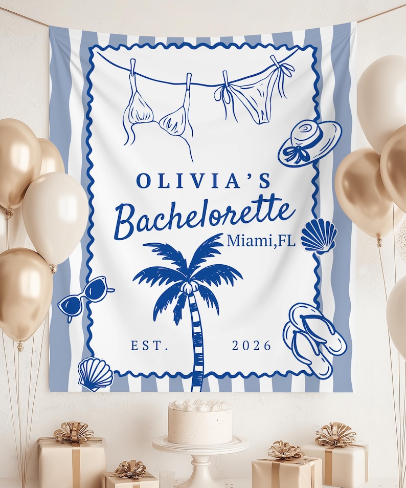 May include: A white and blue beach-themed banner with the text "OLIVIA'S Bachelorette Miami, FL EST. 2026". The banner features illustrations of a bikini, hat, sunglasses, palm tree, seashells, and flip-flops. Gold and white balloons are in the background.