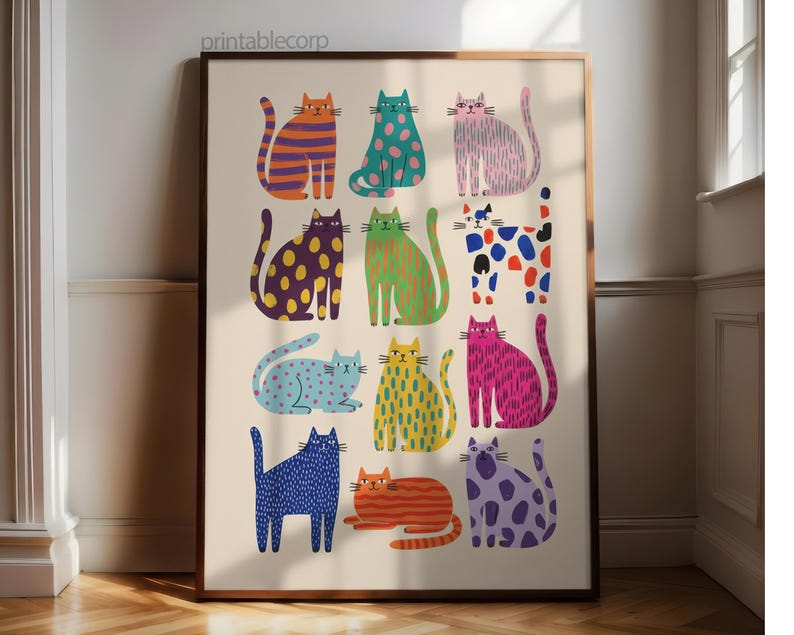 Puede incluir: Una impresi&oacute;n art&iacute;stica enmarcada con doce ilustraciones estilizadas de gatos en varios colores y patrones. Los gatos est&aacute;n dispuestos en una cuadr&iacute;cula, cada uno mostrando un dise&ntilde;o &uacute;nico, incluyendo rayas, lunares y colores s&oacute;lidos. El fondo es beige neutro.