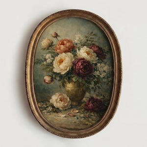 May include: Oval framed floral still life painting. The artwork features a bouquet of peonies in shades of white, peach, and burgundy, arranged in a gold vase. The painting has a vintage aesthetic with a gold-toned frame.