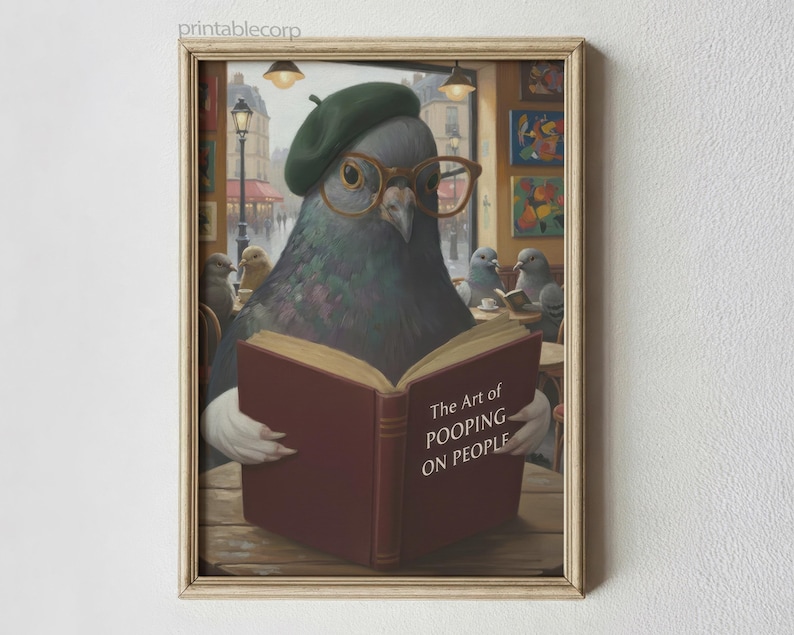 May include: A framed art print featuring a pigeon wearing a beret and glasses, reading a book titled "The Art of Pooping on People." The artwork has a vintage, painterly style, with a cafe setting and other pigeons in the background.