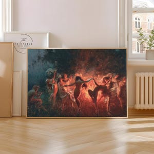 Może przedstawiać: Oprawiony wydruk obrazu przedstawiającego postacie tańczące wokół ognia. Dzieło sztuki wykorzystuje ciepłe odcienie czerwieni i pomarańczy, skontrastowane z chłodnymi błękitami i zielenią. Postacie są w ruchu, tworząc dynamiczną kompozycję.