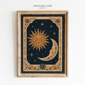 May include: A framed wall art print featuring a dark blue night sky with a golden sun and crescent moon, both with faces. The design is enclosed in a rectangular border decorated with floral patterns and the text PRINTABLE CORP PRINTS.