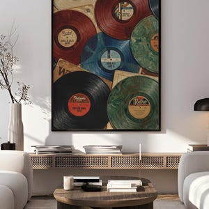 May include: A framed print featuring a collage of vintage vinyl records in various colors, including red, blue, and green. Some records have labels with text like "Soul & Jazz Gems" and "Vintage Vinyl Hits". The print has a retro aesthetic.