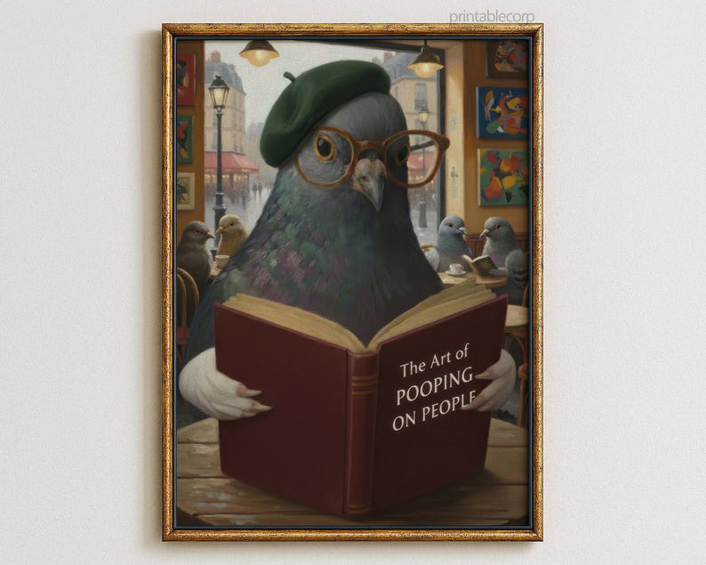May include: A framed print featuring a pigeon wearing glasses and a beret, reading a book titled "The Art of Pooping on People." The artwork has a vintage style, with a gold frame and a cafe setting.