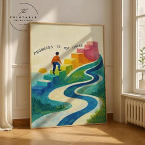 May include: A framed art print with the text "PROGRESS IS NOT LINEAR." The artwork depicts a person climbing colorful steps on a hill, with a winding blue river. The color palette includes shades of green, yellow, orange, and pink.