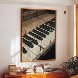 May include: A framed artwork depicts a piano keyboard with miniature figures walking on the keys. The artwork has a wooden frame and the text "printablecorp" is visible in the upper left corner. The artwork is displayed above a wooden cabinet with stacks of books.