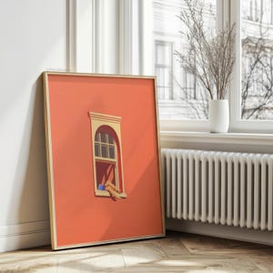 May include: Framed art print featuring a stylized illustration of a window on a coral-colored wall. The window has a beige frame and a person's legs are visible. The artwork is in a gold frame.