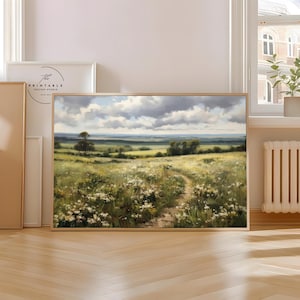 Peut inclure: Peinture de paysage encadrée représentant un champ ensoleillé avec un chemin sinueux. L'œuvre utilise des verts, des jaunes et des blancs, avec un ciel nuageux. La peinture est dans un cadre en bois.