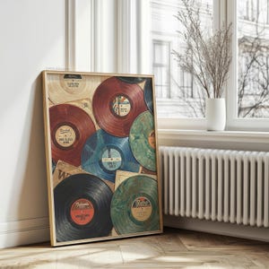 May include: A framed print featuring a collage of vintage vinyl records in various colors, including red, blue, and green. The records are arranged with their labels visible, and the print has a wooden frame. The theme is retro music.