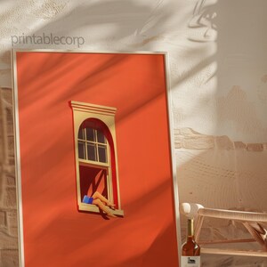 May include: A framed art print featuring a vibrant orange wall with a window. The window has a beige frame and a person's legs are visible, wearing blue shorts. A bottle of wine sits on the floor. The text "printablecorp" is in the upper left corner.