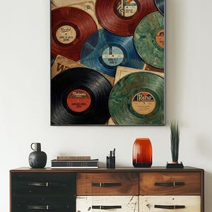 May include: A framed print featuring a collage of vintage vinyl records in various colors, including red, blue, and green. The record labels display text such as "Retro" and "Soul & Jazz Gems". The print is displayed above a wooden dresser.