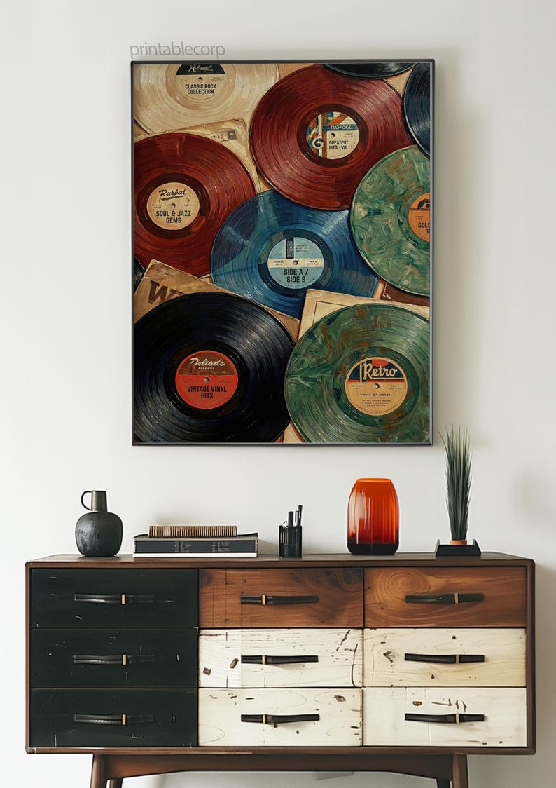 May include: A framed print featuring a collage of vintage vinyl records in various colors, including red, blue, and green. The record labels display text such as "Retro" and "Soul & Jazz Gems". The print is displayed above a wooden dresser.