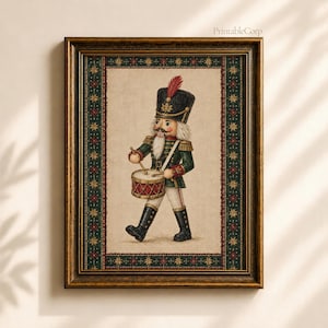 May include: A framed wall art print featuring a nutcracker soldier wearing a dark green uniform with gold accents, a black hat with a red feather, and white trousers. The soldier plays a red drum. The border has a dark green and red star pattern.
