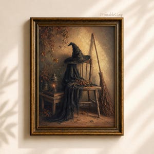 May include: A framed wall art print featuring a dark pointed hat resting on a wooden chair draped with a black cloth. A broom leans against the chair next to a small table holding a lit lantern and autumn leaves. The text PrintableCorp is visible.