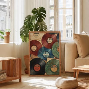 May include: A framed print featuring a collection of vintage vinyl records in various colors, including red, blue, and green. The records are arranged in a collage-like composition, evoking a retro aesthetic. The print is displayed in a well-lit room.