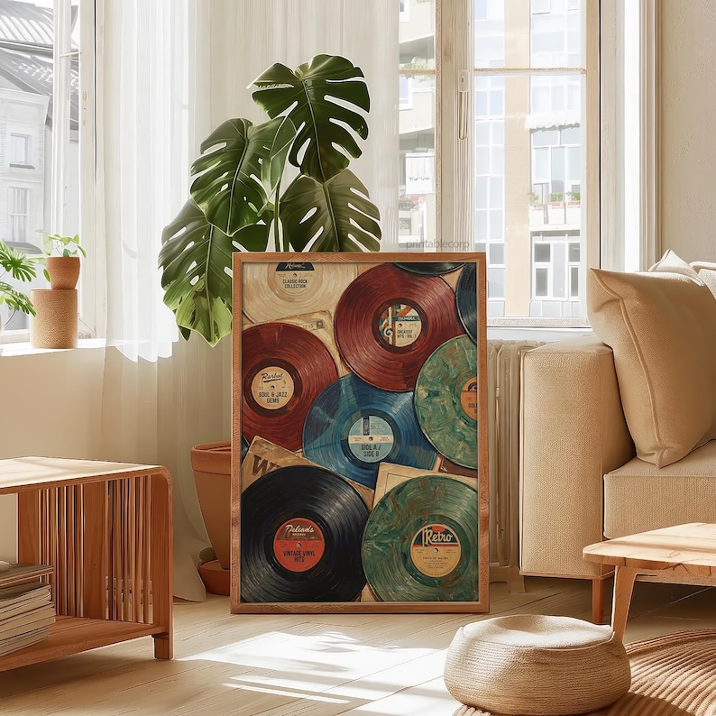 May include: A framed print featuring a collection of vintage vinyl records in various colors, including red, blue, and green. The records are arranged in a collage-like composition, evoking a retro aesthetic. The print is displayed in a well-lit room.