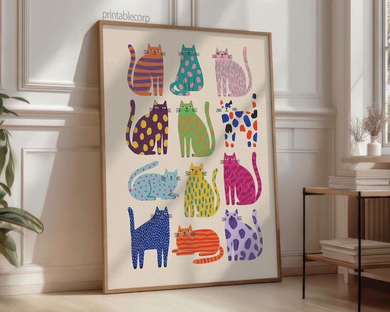 Puede incluir: Una impresi&oacute;n art&iacute;stica enmarcada con ilustraciones de gatos coloridos y estilizados. Cada gato se representa con un patr&oacute;n y color &uacute;nicos, incluyendo rayas, lunares y tonos s&oacute;lidos. La obra de arte se presenta sobre un fondo neutro.