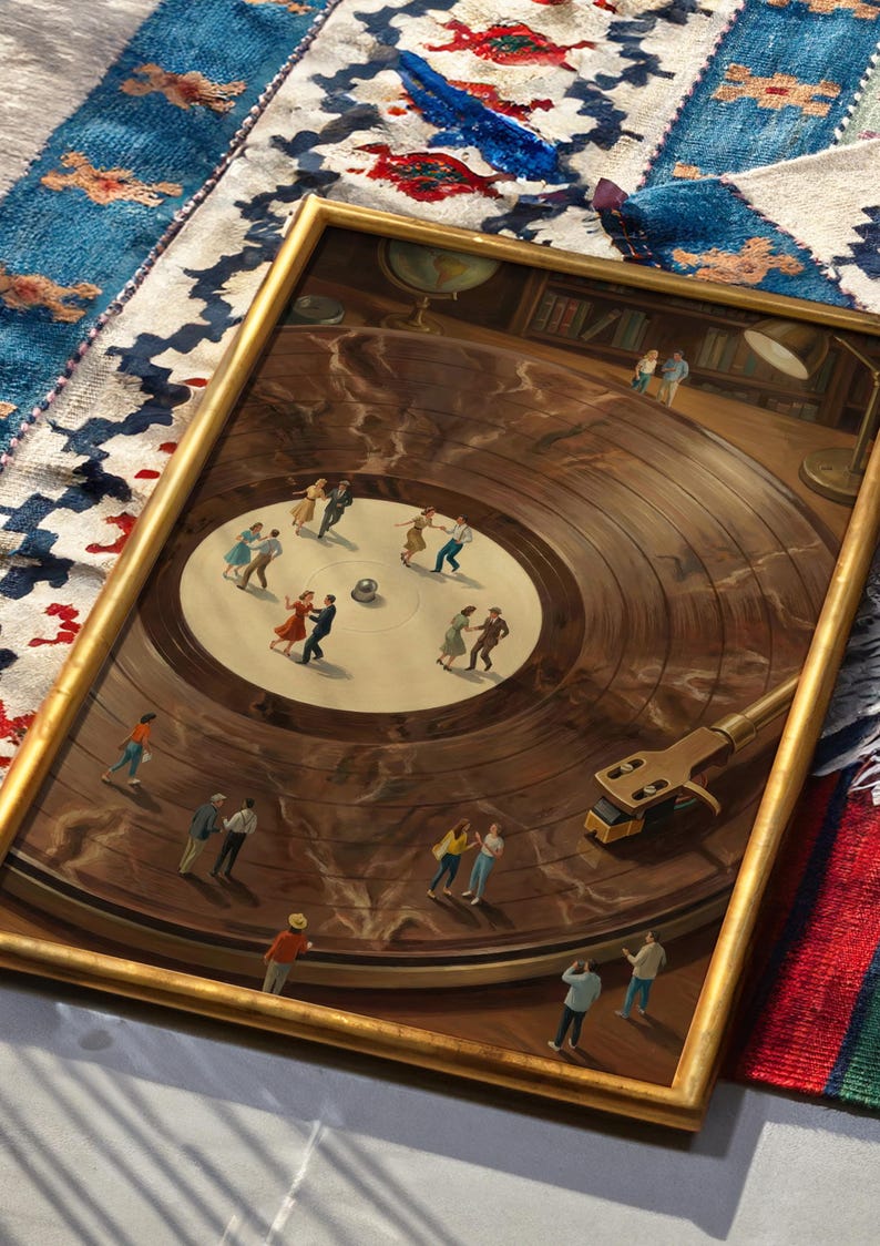 May include: A framed painting depicts a vintage record player with miniature figures dancing on the record's surface. The painting has a gold frame and is set against a patterned rug. The record player's arm and needle are visible.