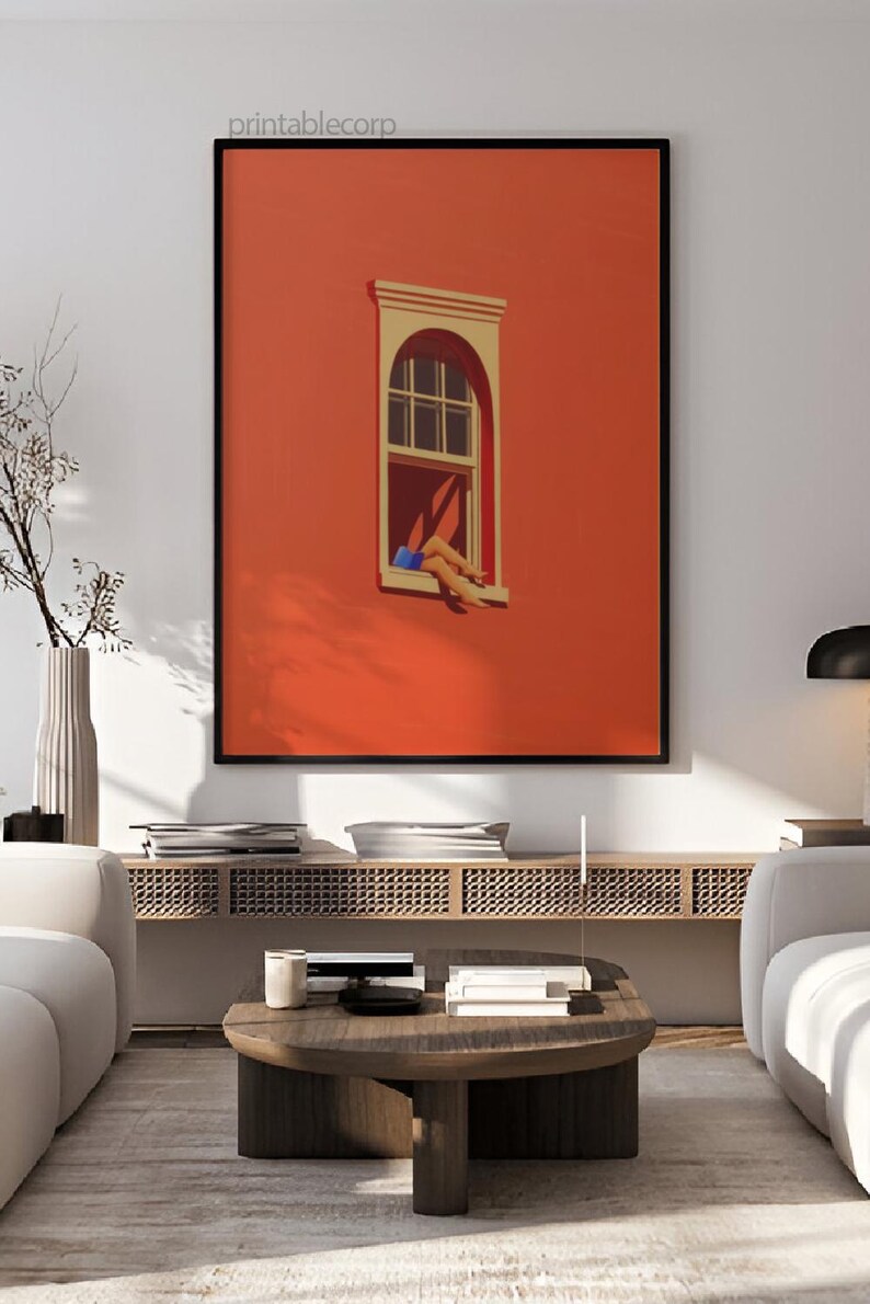 May include: A framed art print featuring a vibrant orange wall with a window. The window has a white frame and a person's legs are visible, with blue shorts. The print is labeled "printablecorp".