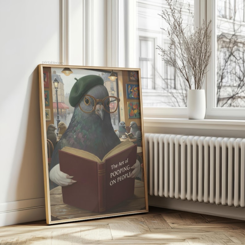 May include: A framed print featuring a pigeon wearing a green beret and glasses, reading a book titled "The Art of Pooping on People." The artwork has a humorous theme, with other pigeons in the background.