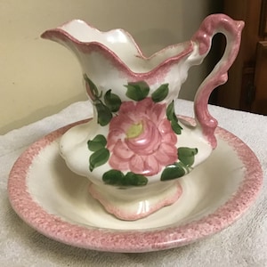 Vintage Cash Family Pottery of a Small Bowl and Pitcher. Hand Painted  With Pink Flowers and Green Leaves on a Cream Background.