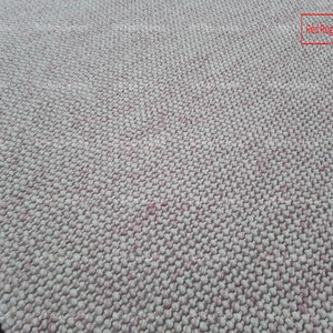 May include: Close-up of a white and pink textured rug with a woven design. The rug is made of small, round balls of yarn. The text "Red Rugs creations" is visible in the top right corner of the image.