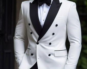 May include: A white double-breasted suit jacket with a black satin lapel and buttons. The jacket has a classic fit and is perfect for formal occasions.