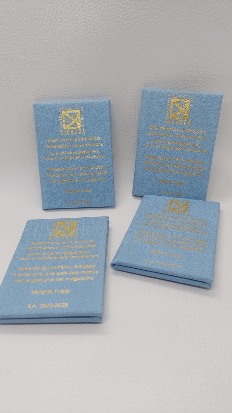 May include: Four blue square cards with gold lettering. The cards have the logo of the University of Bicocca, the department of computer science, and the text "Dipartimento di Informatica, Sistemistica e Comunicazione Corso di Laurea Magistrale in Tecniche e Tecnologie delle Comunicazioni  Rubrica Spreco Ford, Sviluppo frontend di app web e app mobile per la gestione del magazzino  Valeria Froio A.A. 2022-2023"