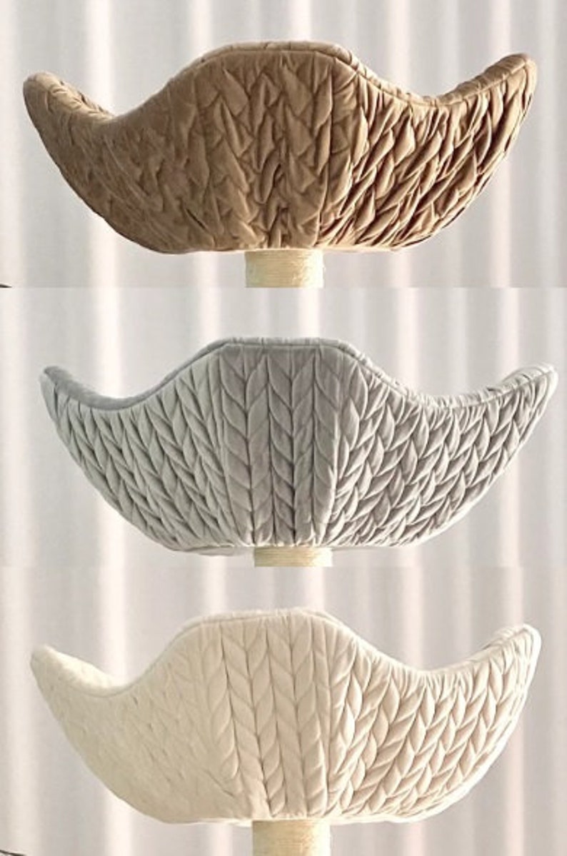 Pode incluir: Tr&ecirc;s ninhos de beb&eacute; de malha de diferentes cores. Os ninhos t&ecirc;m a forma de uma tigela e apresentam um padr&atilde;o de malha de cabo. As cores s&atilde;o bege, cinza claro e branco.
