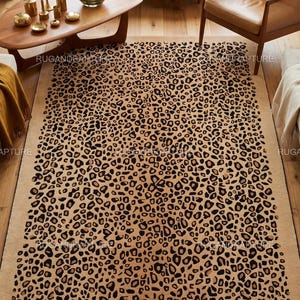 May include: A rectangular area rug with a leopard print design. The rug features a tan background with black and brown spots. The rug is placed on a hardwood floor in a room with mid-century modern furniture.