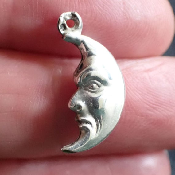 Antique silver pendant, crescent moon, man in moon, moon face