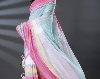 May include: A colorful saree with pink, blue, white, and yellow stripes. The fabric drapes elegantly, showcasing a striped pattern. The saree has tassels in various colors at the end.