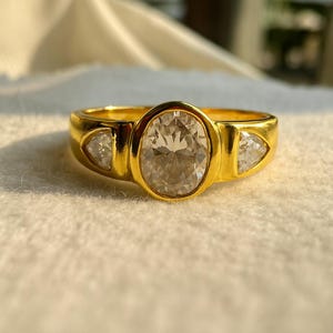 Oval Moissanite Engagement Ring: 10KT Yellow Gold Three Stone Trillion Ring