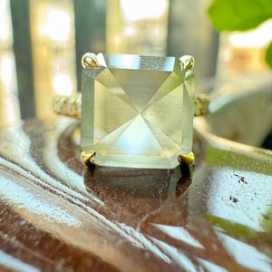 Emerald Cut Moissanite Engagement Ring: Trapezoid Side Stones