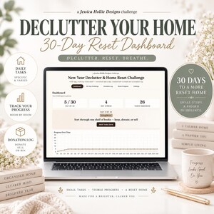 May include: A digital 30-day home declutter dashboard displayed on a laptop screen. The interface shows a progress tracker, daily tasks, and a donation log. The surrounding area includes stacked books, a ceramic mug with text, and a gold pen.