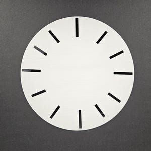 May include: A white clock face with black hour markers on a dark grey background. The clock face has a minimalist design, suitable for DIY projects or home decor. The hour markers are evenly spaced around the circular face.