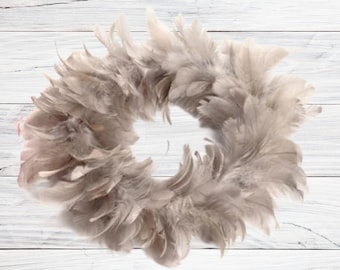 Fluffy round feather wreath for decorating, processing, hanging, as a decoration refined with a glass light in taupe 25 cm