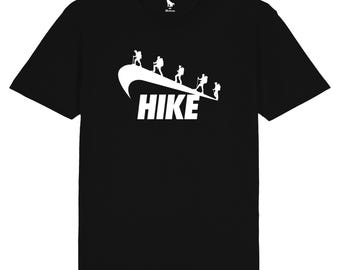 May include: Black t-shirt with a white graphic of hikers walking on a swoosh with the word "HIKE" underneath.