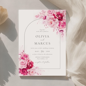 Puede incluir: Invitación de boda con un diseño floral en tonos rosas y rojos. La invitación incluye los nombres Olivia y Marcus, la fecha 26 de marzo de 2050 y la ubicación Opolo Vineyards, Paso Robles, CA.