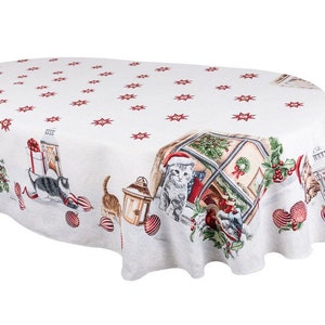 May include: White oval tablecloth with a red star pattern and a Christmas scene featuring cats, presents, and lanterns. The tablecloth has a scalloped edge.