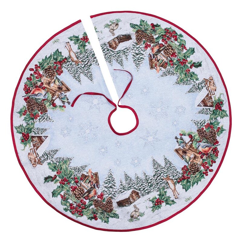 May include: A blue and white Christmas tree skirt with a winter scene featuring birds, houses, and pine trees. The skirt has a red trim and a white ribbon.