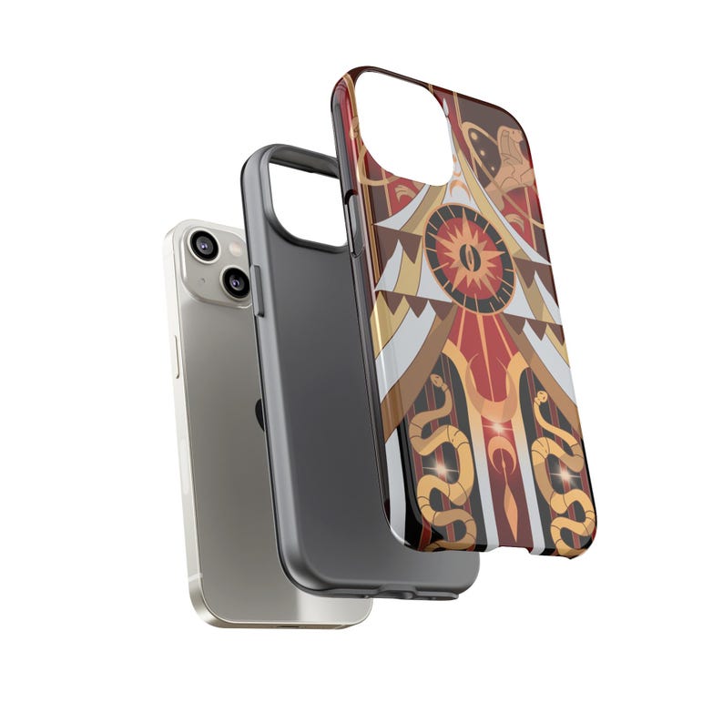 May include: A silver smartphone with a black case and a decorative phone case. The decorative case features a geometric design with red, gold, and brown colors, including a sun and snake motif.
