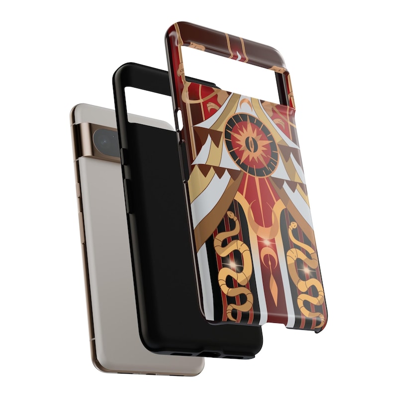 May include: A phone case with a colorful geometric design featuring red, gold, and white shapes, including a central eye and stylized snakes. The case is shown with a black phone case and a white phone.