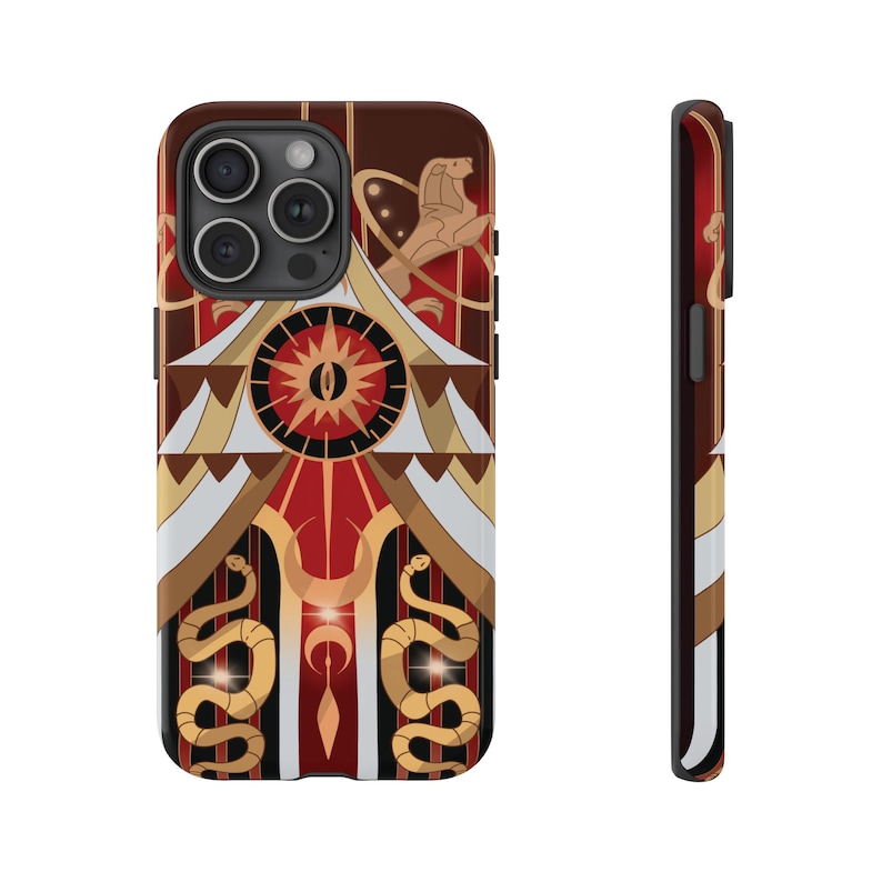 May include: A phone case featuring a detailed design with a red, brown, and gold color scheme. The design includes a central eye-like symbol, a serpent, and a lion-like figure. The case has a black border and a glossy finish.