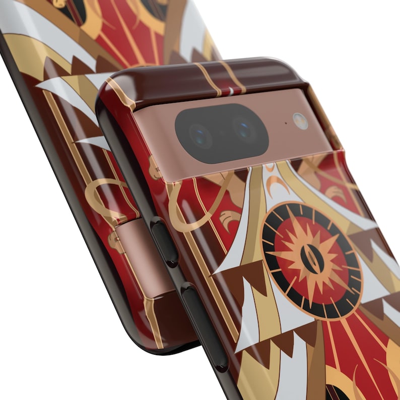 May include: Close-up of two phone cases with a repeating geometric design in red, gold, brown, and white. The cases have a glossy finish and a camera cutout. The design features a central circular element with radiating lines.