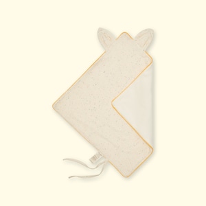 May include: A white and yellow baby blanket with a speckled pattern and two small ears on the top. The blanket is tied with a white ribbon.