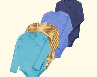 May include: Four long-sleeved baby bodysuits in shades of blue, yellow, and a striped pattern. Each bodysuit has a wrap-style design with snap closures. The bodysuits are made of a soft material and are arranged diagonally against a light background.